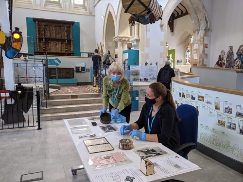 Staff and volunteers sharing our handling collection with a group visit